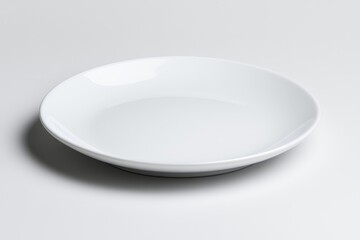 Poster - White plate with fork and knife isolated on a white background, top view, flat lay. A simple, clean, minimalistic background concept of dinnertime or food service. Copy space available. High-quality,