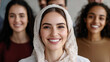 © Michael - Portrait of a smiling young muslim businesswoman wearing an hijab, her team stands behind her