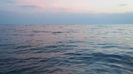 Poster - Observe tranquil beauty as sun sets on horizon, casting soft hues across ocean. Gentle waves ripple peacefully, creating a serene atmosphere that invites reflection. Mediterranean Adriatic Sea.