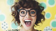 © Michael - Joyful young woman wearing glasses laughing exuberantly, bright colored backdrop highlighting radiant expression
