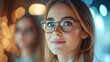 © Michael - Close-up of businesswoman wearing eyeglasses and smiling with a blurred background and bokeh effect