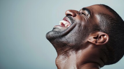 Sticker - The image captures a moment of joy and celebration, featuring a person laughing heartily with their head tilted back, expressing pure happiness and exhilaration.