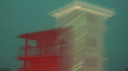 Poster - Blurred tower in abstract nightscape with vibrant colors and dynamic movement