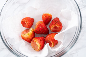 Wall Mural - Washed and Dried Strawberries Neatly Stored in a Glass Bowl