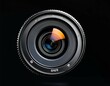 © Timothy - camera lens isolated on black background