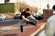 © Geber86 - Young man stretching before exercising in the city