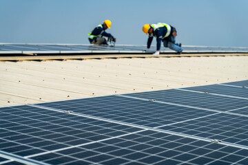 Wall Mural - team of professionals installs solar panels, ensuring energy efficiency and sustainable development.