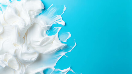 Poster - Artistic abstract of thick foam smears on vibrant blue background for modern design