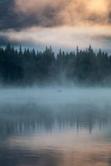 Poster - Misty morning on Trillium Lake. Two fishermen in a small boat, silhouetted against the fog. Peaceful scene.  Oregon, United States