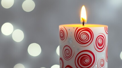 Poster - Festive candle with red swirl design lit against blurred bokeh light background at holiday celebration. Warm ambiance and decor concept