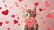 © arri - Adorable Kitten Holding Pink Valentine Envelope Amidst Hearts