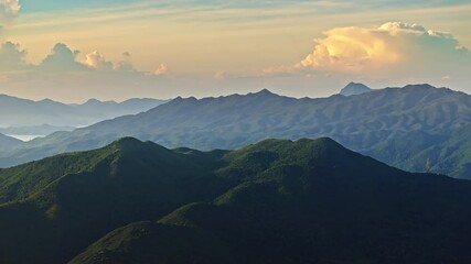 Canvas Print - Aerial view of green mountains and dramatic sky clouds nature landscape at sunrise