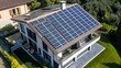 © Aleksandr S - A modern house showcases a generous array of solar panels on its rooftop, emphasizing green energy and eco-friendly living in a serene environment with a clear blue sky