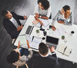 © peopleimages.com - Above, meeting and business people in office, collaboration and documents with planning. Employees, consultant or review with cooperation, tablet or technology with support, feedback or brainstorming