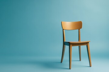 Wall Mural - A wooden chair placed on a blue backdrop for a clean design