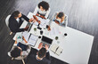 © peopleimages.com - Above, documents and business people in office, cooperation and planning for project. Employees, consultant and meeting with discussion, tablet or technology with support, collaboration or feedback