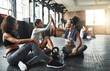 © Donson2000/peopleimages.com - Happy women, fitness and team with high five for winning, success or well done together at indoor gym. Excited, female people or active group of friends with smile for workout mission at health club