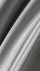 Poster - Flowing gray silk fabric waves creating elegant textured patterns in motion