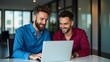 © Royal studio - two business colleagues engaged in a discussion while watching a laptop screen in a professional corporate setting, emphasizing teamwork, productivity and effective business collaboration