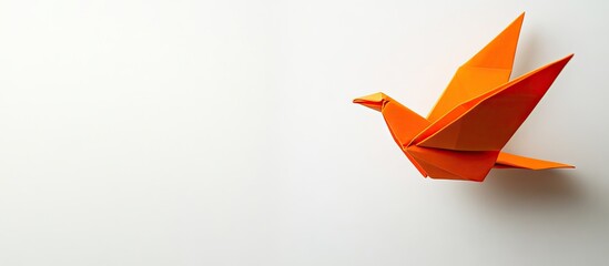 Poster - Bright orange origami dove positioned in the bottom right corner on a smooth white background, symbolizing peace and creativity in art.