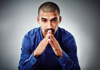 Poster - Hands together, portrait and thinking with business man in studio for ambition, inspiration or opportunity. Concentration, idea and mission with serious employee on gray background for development