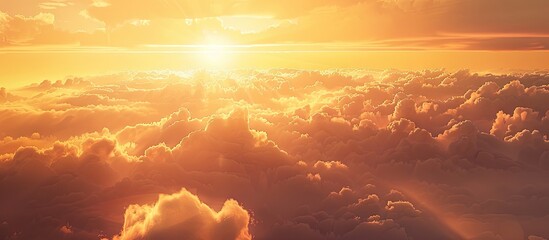 Poster - Vibrant sunset sky with orange and yellow hues illuminating fluffy clouds creating a serene outdoor ambiance perfect for background use