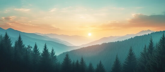 Poster - Serene sunset over lush green mountain ranges with soft blue and warm orange hues, creating a tranquil evening atmosphere in the background.