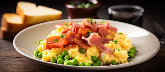 Aufkleber - Scrambled eggs topped with peas and ham on a white plate with toast in the background garnished with herbs on a wooden surface