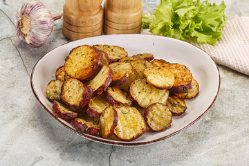 Wall Mural - Baked red batat slices with herbs