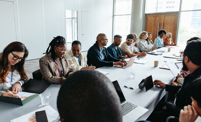 Wall Mural - diverse group of people in a business meeting having a discussion in a modern office