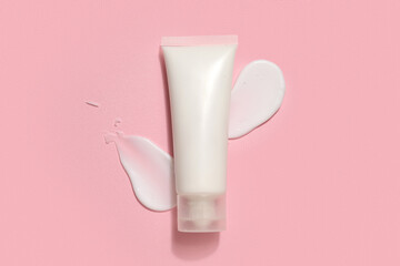 Canvas Print - Tube with samples of cosmetic product on pink background