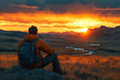 © A10zon Studio - A man sits on the edge of an open field overlooking a scenic landscape, symbolizing peace and reflection