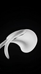 Poster - Abstract white fluid motion against black background in dynamic transformation