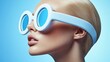© Rendra - Blonde model, oversized glasses, blue backdrop