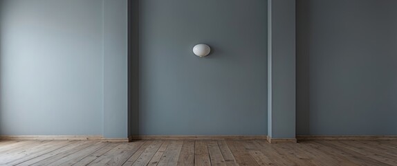 Poster - Minimalist interior with gray walls and wooden flooring showcasing simplicity and elegance in modern home design.
