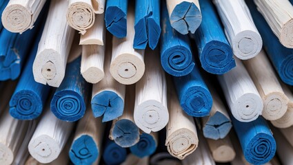 Poster - Textured background of rolled blue and white sticks creating a visually appealing abstract pattern for design and decoration use.