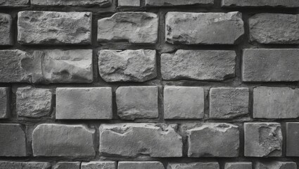 Poster - Textured gray stone wall featuring irregular bricks creating a rustic and industrial atmosphere for architectural backgrounds or design projects.