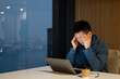 © zhu difeng - asian businessman working with laptop