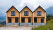 © Kenn W. - Modern wooden terraced houses under construction with large windows