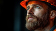 © Naqash - A contemplative construction worker gazes upward, his rugged beard and hopeful eyes reflecting the weight and promise of his labor against a dark, moody background.