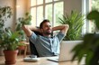 © Viktor - Man relaxing in home office. Businessman smiles leaning back on chair looking away from laptop. Break time on workplace. Online work. Freelancer resting, dreaming with hands behind head. Mental