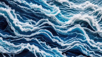 Poster - Ocean wave patterns with white foam creating a textured blue background suitable for design and artistic applications.
