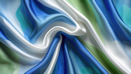 Aufkleber - Elegant blue and white silk fabric with green shades, showcasing smooth texture and flowing drape against a neutral background.