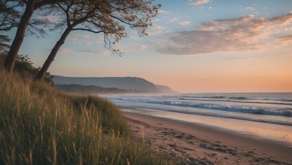 Aufkleber - Serene Beach Landscape at Sunset with Gentle Waves and Lush Grass in Foreground Reflecting Nature's Colors