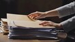 © Arifin Studio - Woman sorting files on desk, office paperwork