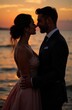 © chelmicky - Bride and groom sharing a romantic moment at sunset on the beach