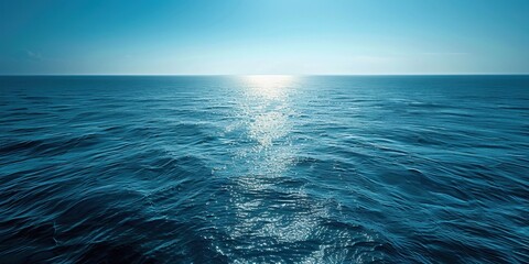 Poster - Vast Ocean Surface with Glowing Sunlight Reflection at Horizon