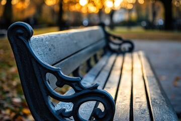 Aufkleber - A park bench sits in the middle of a green park, surrounded by trees and flowers