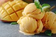 © Alla - A scoop or two of creamy mango ice cream sitting next to a fresh, ripe mango