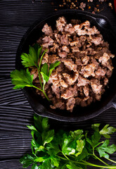 Canvas Print - Pan fried minced meat to Italian pasta. Gray background. Top view.